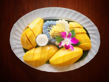 Mango and sticky rice on the vintage backgroundの写真素材
