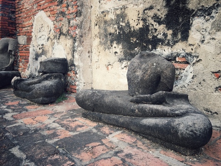 ancient remains of thai people ,Buddha head in the banyan tree of historical parkの写真素材