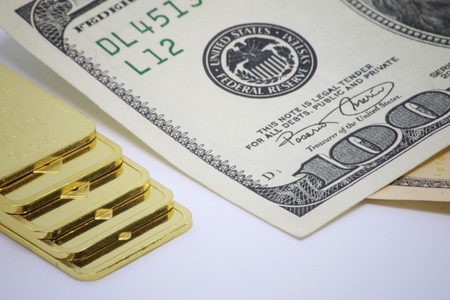 Gold bar ingot close up on the white backgroundの写真素材