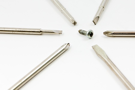 Head screwdriver and screws on a white background.の写真素材