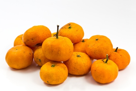 Mandarins on a white background. Several small mandarin fruit.の写真素材