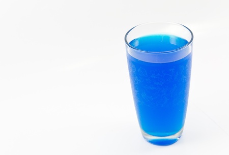 Glass and blue water on a white background.の写真素材