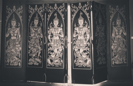 Decorated wooden doors at the temple in Thailand.の写真素材