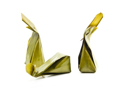 Sweets wrapped in banana leaves.の写真素材