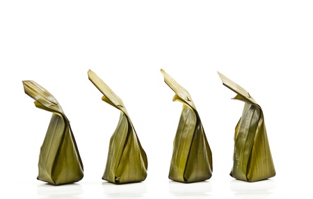 Sweets wrapped in banana leaves.の写真素材