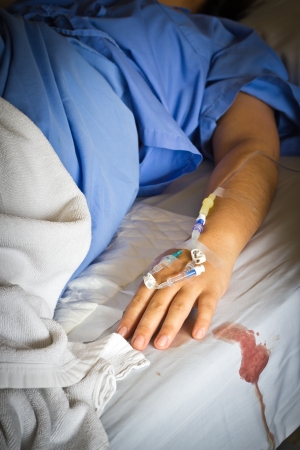 A hospital patient with an intravenous dripの写真素材