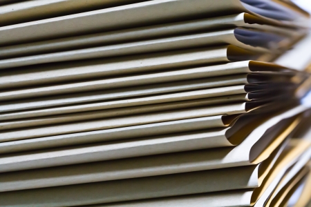 Piles of paper stacked several layers Put the document together 