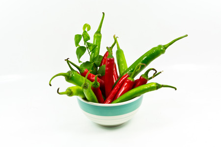 Many chili placed on white background.の写真素材