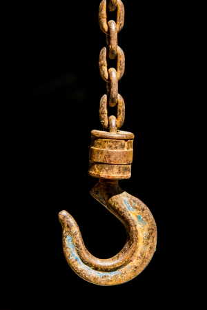 Iron hooks on dark background の写真素材