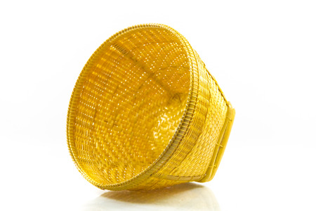 Woven bamboo containers on white background の写真素材