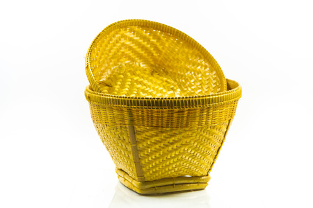 Woven bamboo containers on white background の写真素材