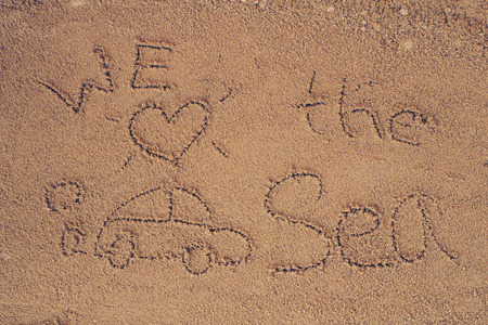 written on sand.sea and sand background.Concepcion tour over the summer.の写真素材