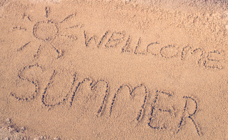 written on sand.sea and sand background.Concepcion tour over the summer.の写真素材