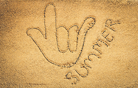 written on sand.sea and sand background.Concepcion tour over the summer.の写真素材
