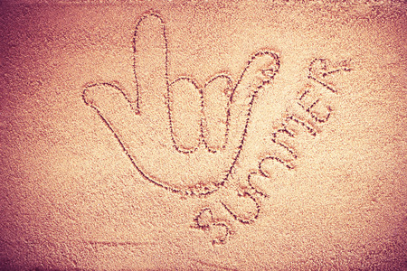 written on sand.sea and sand background.Concepcion tour over the summer.の写真素材