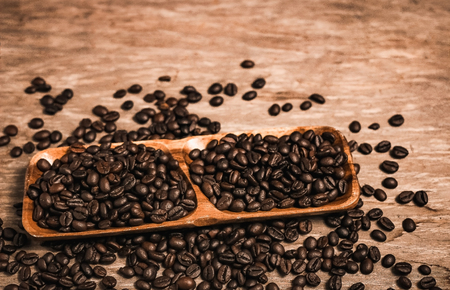 Coffee beans and wooden container with copy space.の写真素材