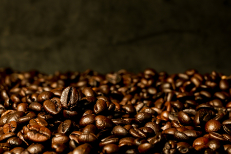 Roasted coffee beans on wooden background.の写真素材