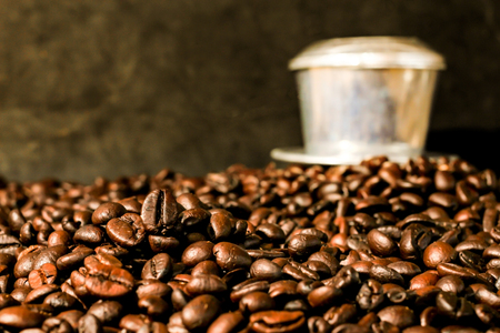 Coffee beans and stainless steel cup with copy space.の写真素材