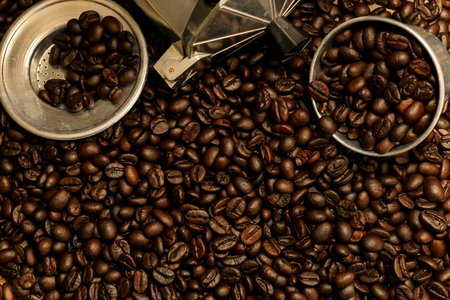 Hot coffee roasted with moka pot and stainless steel cup.roasted coffee beans.の写真素材