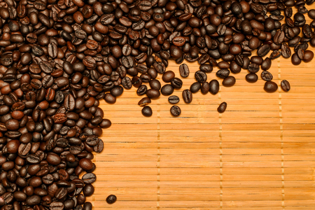 Roasted coffee beans on wooden background.の写真素材