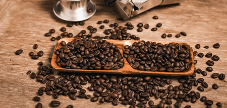 Hot coffee roasted with moka pot and stainless steel cup.roasted coffee beans.の写真素材