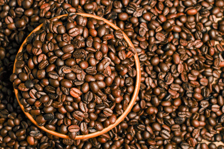 Coffee beans and wooden container with copy space.の写真素材
