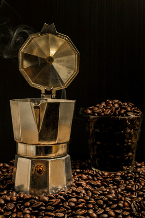 Hot coffee roasted with moka pot.roasted coffee beans.の写真素材