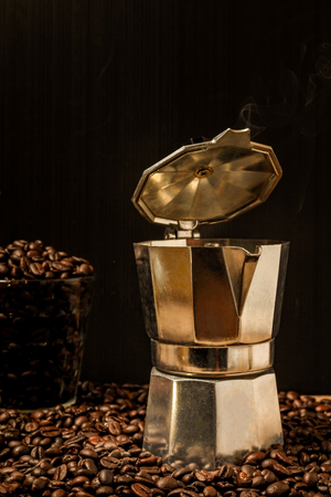 Hot coffee roasted with moka pot.roasted coffee beans.の写真素材