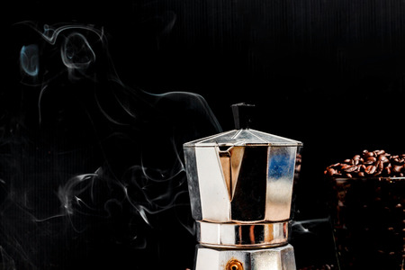 Hot coffee roasted with moka pot.roasted coffee beans.の写真素材