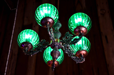 Green lamp on wood backgroundの写真素材
