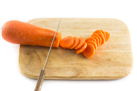 fresh carrot with knife on cutting boardの写真素材