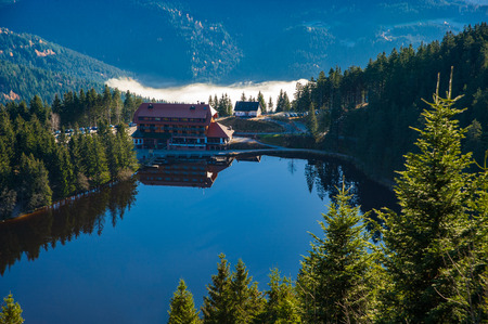The lake Mummelsee and the mountain hotel in Seebach, Black Forest, Baden-Wuerttemberg, Germany, Europeのeditorial素材