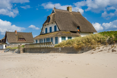 Holiday cottage on the peninsula and nature reserve Graswarder in Heiligenhafen at the Baltic Seaの写真素材