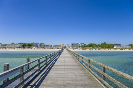 The south beach with pier in Grossenbrodeの写真素材
