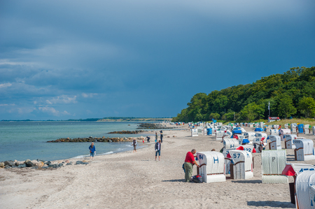Beach of Hohwachter bay with beach chairs and tourists in Hohwacht at the Baltic Seaのeditorial素材