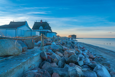 Shore of the nature reserve Graswarder with historical villa in wintry landscape in Heiligenhafen at the Baltic Seaのeditorial素材