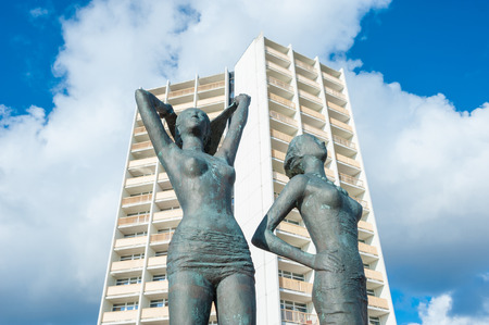Bronze sculpture, Girl on the south beach, in front of the facade of the Hotel and holiday center IFAのeditorial素材
