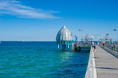Pier with tourists and diving bell in Groemitz at the Baltic Seaのeditorial素材