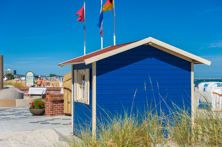 Beach promenade in Groemitz at the Baltic Sea with a hut to rent beach basketsのeditorial素材