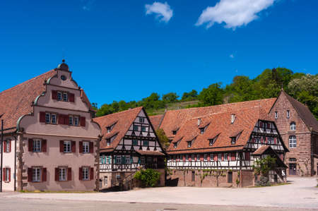 Maulbronn, Germany - April 30, 2018: Historic half-timbered houses in the courtyard of Maulbronn Abbey. Maulbronn Monastery is located in Maulbronn and is a Unesco World Heritage Siteのeditorial素材