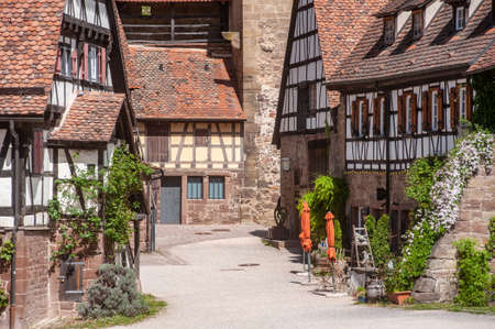 Maulbronn, Germany - April 30, 2018: Historic half-timbered houses in the courtyard of Maulbronn Abbey. Maulbronn Monastery is located in Maulbronn and is a Unesco World Heritage Siteのeditorial素材