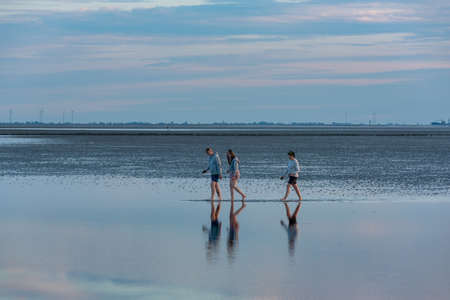Wadden hikers in the National Park Wadden Sea. Dorum-Neufeld in Lower Saxony in Germanyのeditorial素材