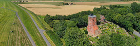 Panorama aerial view with the Ochsenturm near Imsum on the German North Sea coast. The Ochsenturm is...