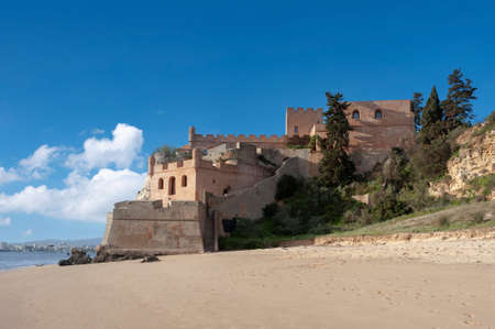 Ferragudo, Portugal - March 26, 2018: Beach and castle Sao Joao do Arade in Ferragudo in the Algarve in Portugalのeditorial素材