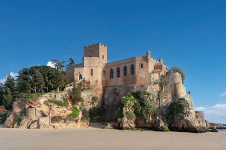 Ferragudo, Portugal - March 26, 2018: Beach and castle Sao Joao do Arade in Ferragudo in the Algarve in Portugalのeditorial素材