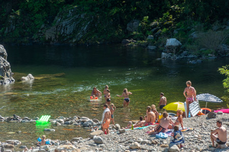 Cannobio, Italy - August 11, 2018 - Bathing area at the church of Sankt Anna on the Cannobino river in Valle Cannobina near Cannobio. Cannobio is a town in the Piedmont regionのeditorial素材