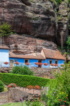 Eschbourg, France - July 27, 2021: Historic rock dwellings, Maison des rochers, in Graufthal. Bas-Rhin department in the Alsace region of Franceのeditorial素材