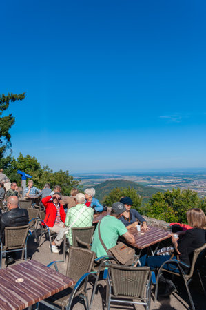 Orschwiller, France - September 16, 2021: Tourists at viewpoint in front of ChÃ¢teau du Haut Koenigsbourg near Orschwiller. In background Upper Rhine Plain and hilly landscape of Black Forest. Bas-Rhin department in region in Franceのeditorial素材