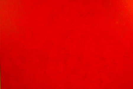 Red leather texture closeup, useful as backgroundの写真素材