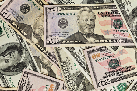 Fifty dollar bills money pile.の写真素材